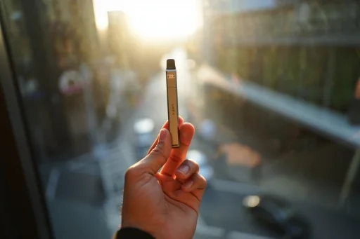 Close-up of a Uwell disposable vape showcasing its sleek, portable design.